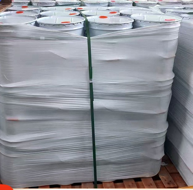 Pails of adhesive wrapped and strapped for export shipment